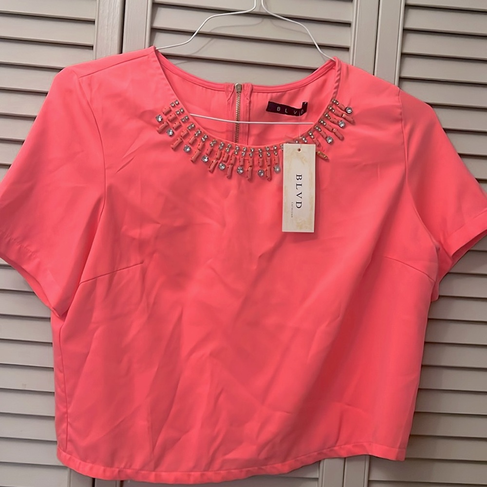 Fuchsia, pink crop top brand new with tags has a little bit loose in the front